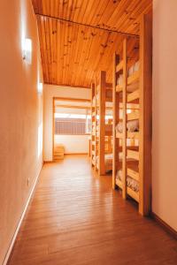 a room with bunk beds and a wooden ceiling at Gaia Beach House in Vila Nova de Gaia