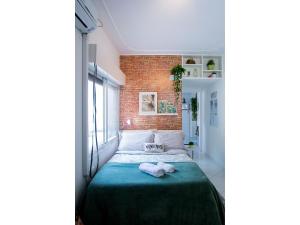 Ένα ή περισσότερα κρεβάτια σε δωμάτιο στο Sossego na Cidade Baixa