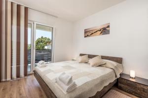Posteľ alebo postele v izbe v ubytovaní Vila Mia Opatija Dražice + 37 fotografií