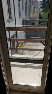 a view from the inside of a window at Suites storica in Palazzo antico del 1858 in pieno centro in Agnone +23 photos