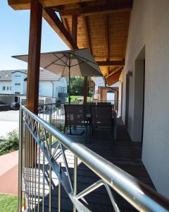 a patio with a table and an umbrella at Peter's in Koppl