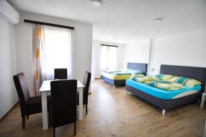 Letto o letti in una camera di Vulsa Apartmani