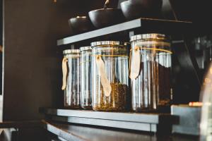 a group of jars of food sitting on a shelf at Hotel Viking Aqua Spa & Wellness in Sæby