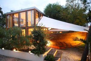 a house with a wooden boat in the yard at Campo Di Fiori, Maisons de Charme in Calvi +62 photos