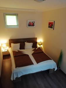 Posteľ alebo postele v izbe v ubytovaní My Home Apartman