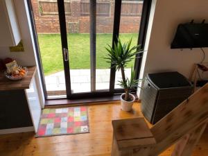 a living room with a door open to a yard at Casa in Gateshead