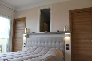 A bed or beds in a room at Villa Martina Luxury Rooms