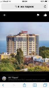 a picture of a large building with the ocean behind it at Французский Бульвар ЖК Париж in Odesa