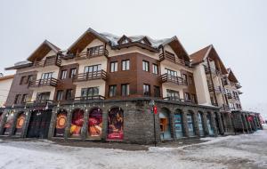 a large building on the side of a street at New Gudauri Suites N317 in Gudauri