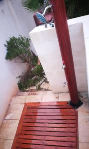 a red rug on the ground next to a door at Villa Favignana in Favignana