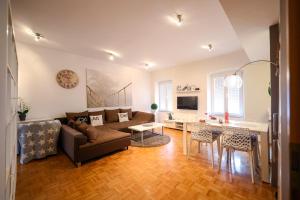 a living room with a couch and a table at Stomorica Apartments in Zadar