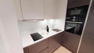 Kuchyň nebo kuchyňský kout v ubytování White Pearl Apartment 1.10 + 22 fotografií