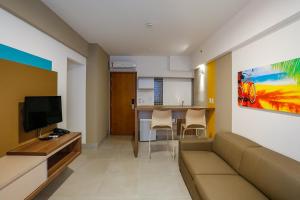 Телевизия и/или развлекателен център в Apartamento em Resort de Olimpia