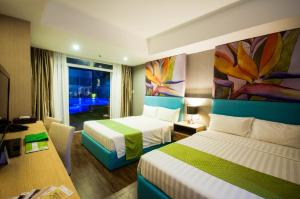Postel nebo postele na pokoji v ubytování Aziza Paradise Hotel