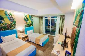 Postel nebo postele na pokoji v ubytování Aziza Paradise Hotel
