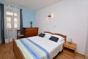 Uma cama ou camas num quarto em Apartment Skoric