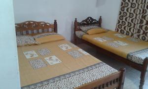 Ένα ή περισσότερα κρεβάτια σε δωμάτιο στο Kunam Beach Rest Inn