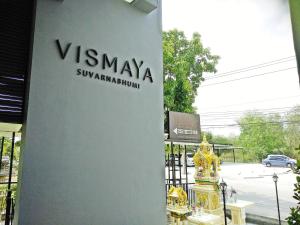 a yellow fire hydrant in front of a building at Vismaya Suvarnabhumi Hotel in Lat Krabang