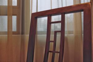 a close up of a door with a window at Butterfly on Wellington, Central in Hong Kong