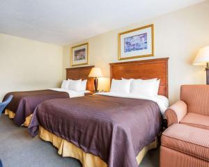 En eller flere senger på et rom på Budgetel Inn & Suites Atlanta