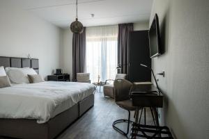 Postel nebo postele na pokoji v ubytování Fruitpark Hotel & Spa