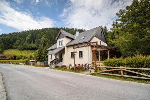 a building on the side of a road at Camping & Glamping Jezersko ex Cvet Gora in Zgornje Jezersko