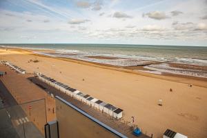 an aerial view of a beach with the ocean at De Zee in Ostend