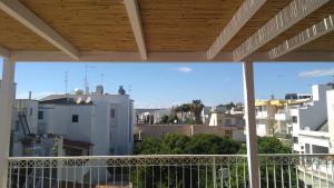 a view of the city from a balcony at B&B Sara in Santa Maria al Bagno