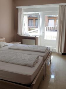 Postel nebo postele na pokoji v ubytování Oostduinkerke - Appartement met zeezicht en 2 parkeerplaatsen