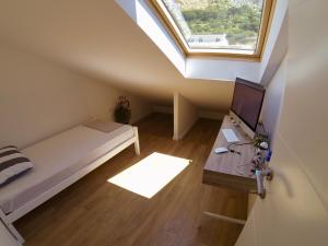 TV a/nebo společenská místnost v ubytování Geek Apartment