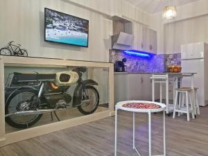 a motorcycle in a display case in a kitchen at veraghi apartment 1 in Lefkada