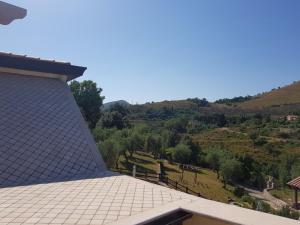 a view from the roof of a house with a mountain at La Gazza in Itri