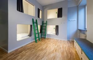 a room with a blue wall and a blue floor at Winstrup Hostel in Lund