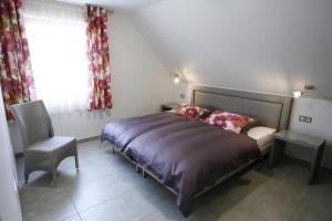 Postel nebo postele na pokoji v ubytování B&B Relais du Vigneron - Jean-Luc et Bruno Meyer