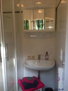 a bathroom with a sink and a mirror at Petit Studio in Lorgues