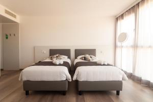 Hotel Albergo Milano客房内的一张或多张床位
