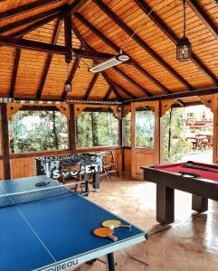 a room with a pool table in a house at Raza de Soare in Breaza