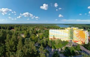 an aerial view of a building in the woods at AHORN Seehotel Templin in Templin