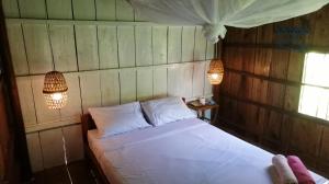 Katil atau katil-katil dalam bilik di Q Bungalows