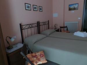Posteľ alebo postele v izbe v ubytovaní B&B Partenza Funivia