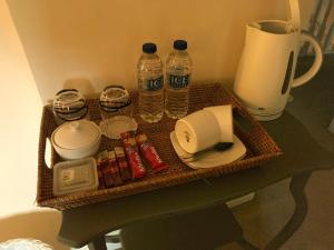 a table with a tray of food and water bottles at The Rag House in Upton upon Severn