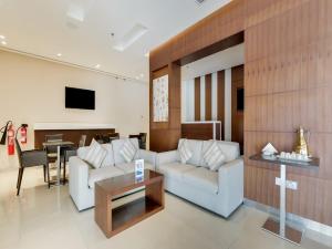 TV a/nebo společenská místnost v ubytování Action Hotel Ras Al Khaimah