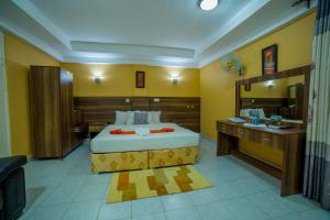 Postel nebo postele na pokoji v ubytování Eureka Place Hotel Kampala