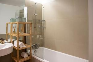 a bathroom with a shower and a sink at Principe Real Apartment in Lisbon