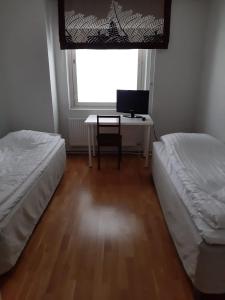 Postel nebo postele na pokoji v ubytování Apartment Asemakatu 20