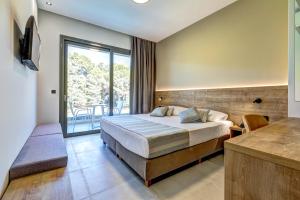 Voodi või voodid majutusasutuse White Olive Elite Laganas toas