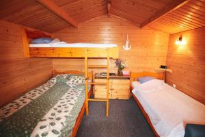 Voodi või voodid majutusasutuse Põhja Tooma Holiday Houses toas
