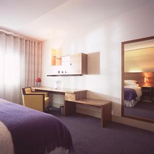 Posteľ alebo postele v izbe v ubytovaní Osprey Hotel