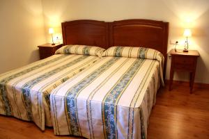 Voodi või voodid majutusasutuse Hotel Rústico Casa do Prado toas