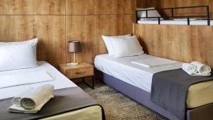 Voodi või voodid majutusasutuse Hotel Alpha toas
